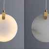 Lumis258 Sphère Verre Opalin et Laiton Minimaliste