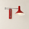 Amphitrite rouge — applique articulée sur un mur ivoire